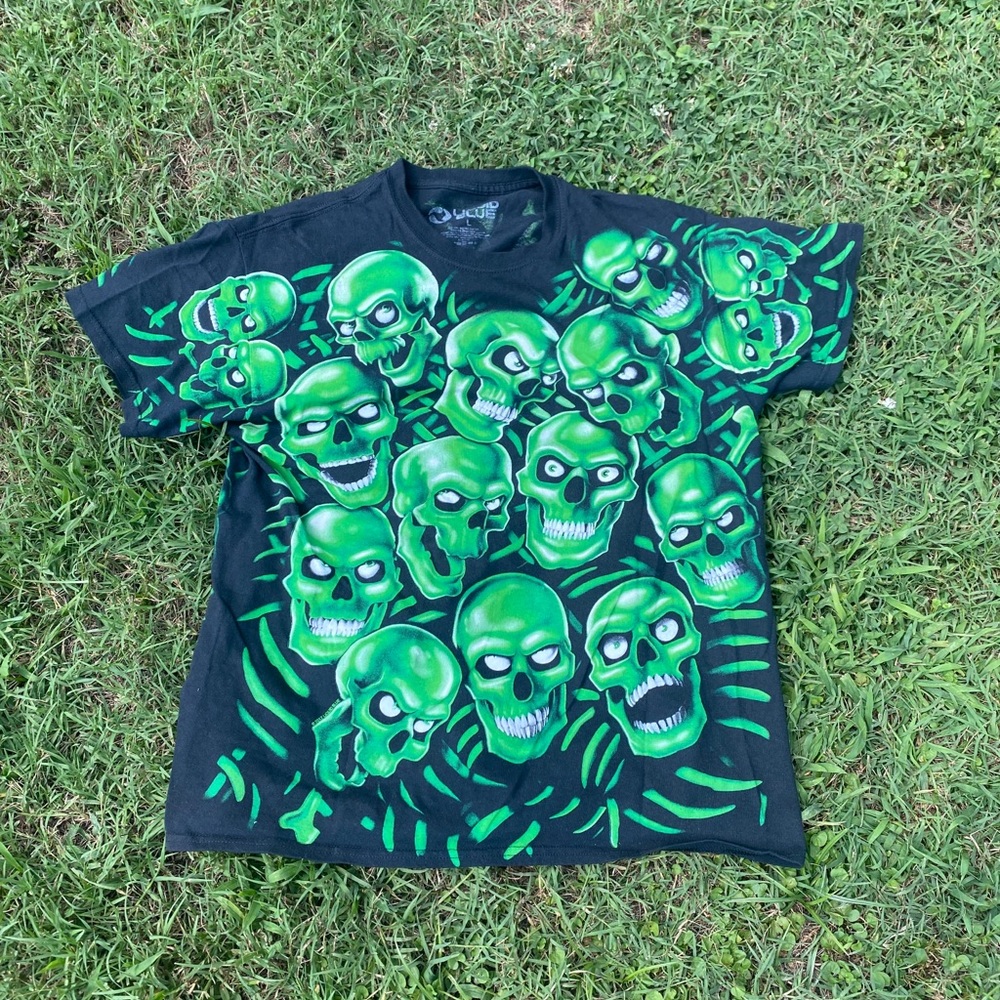 Liquid blue pile of skulls shirt